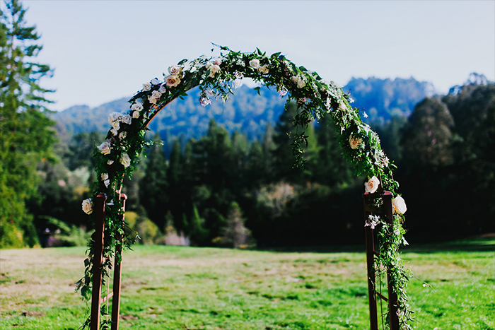 rustic floral arch for ceremony