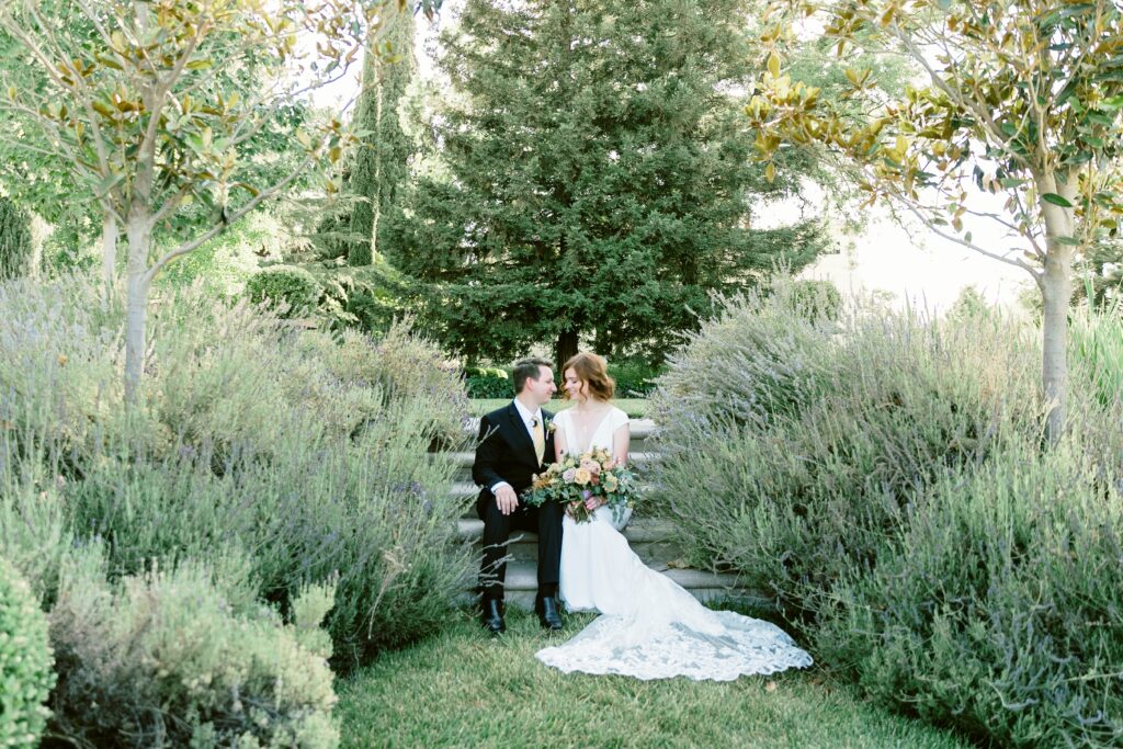 best elopement locations in northern california bride and groom sitting near lavendar