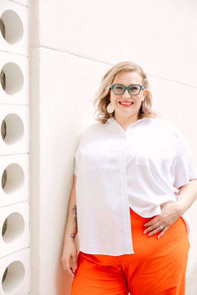 Sacramento Brand Photography session with woman in orange pants, blonde hair, and blue glasses