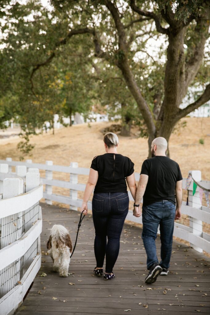 sacramento engagement photography capturing a stroll with beloved fluffy dog