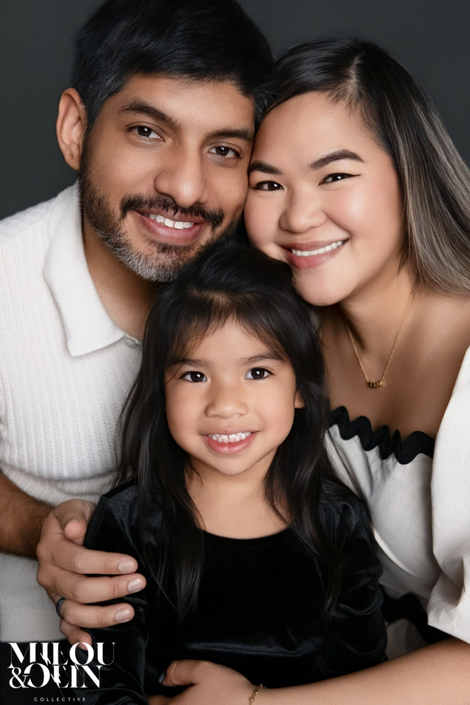 Close-up family portrait of parents and daughter in a Sacramento photography studio. Emotional family photography focused on genuine connection and timeless portrait artwork.